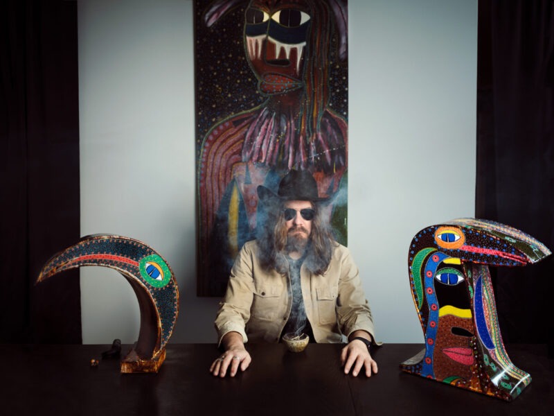 Tom Wilson in a room with art