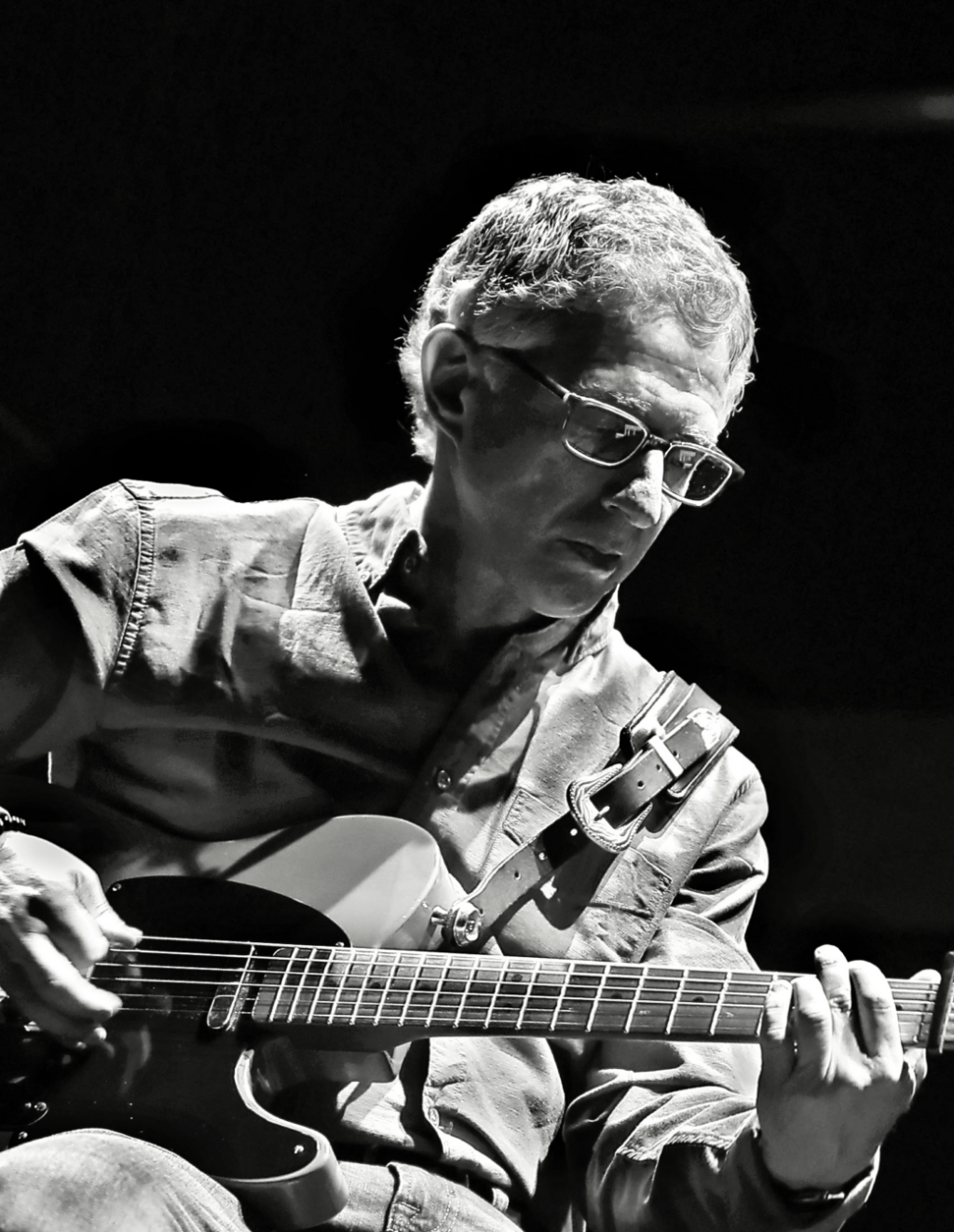 Don Denaburg Playing Guitar